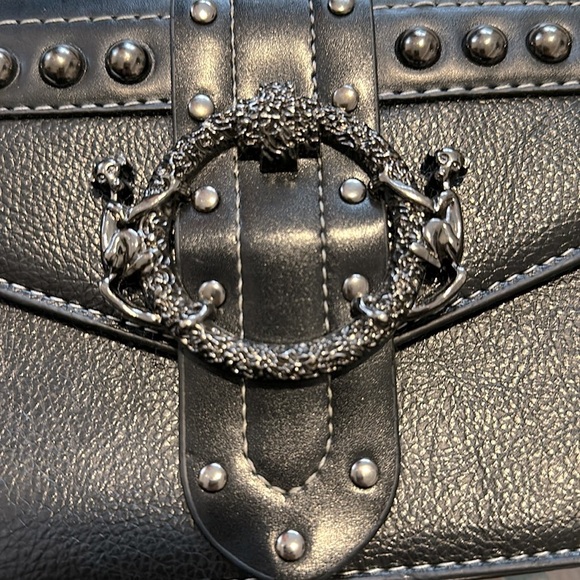 Black mini bag with monkey buckle. - Picture 2 of 7